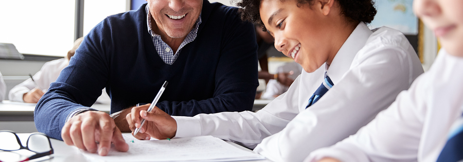 High school teacher tutoring a student