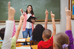 Teacher calling on student with raised hand