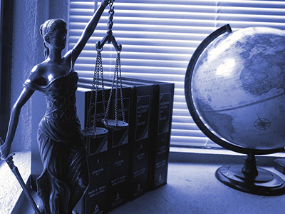 Lady justice statue with school globe