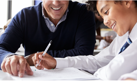 Teacher helping student