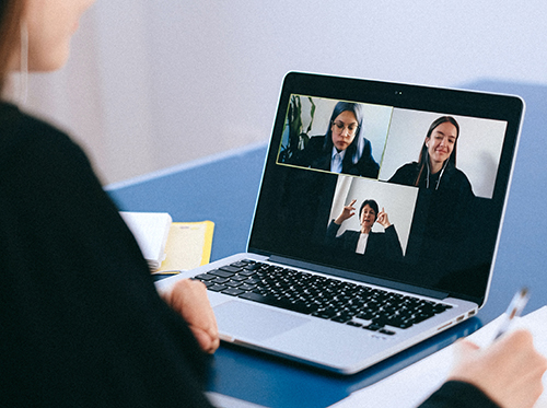 Videoconference on laptop with multiple participants